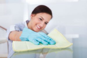 Woman Cleaning Table